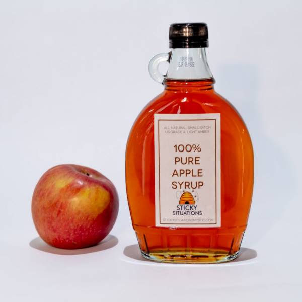 Picture of sticky situations 12 oz apple syrup with a honeycrisp apple to the left